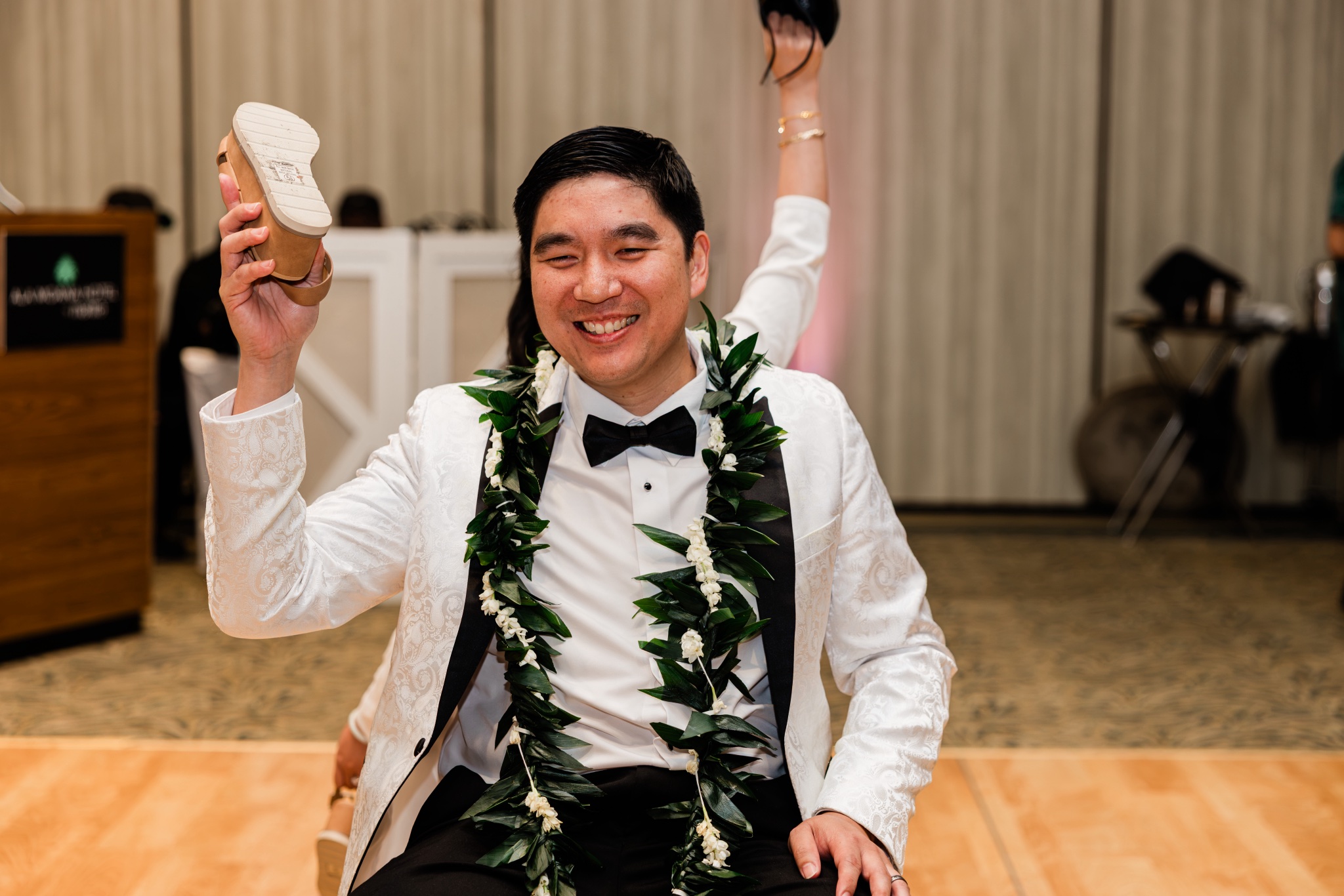Joyful moment during an Oahu wedding reception