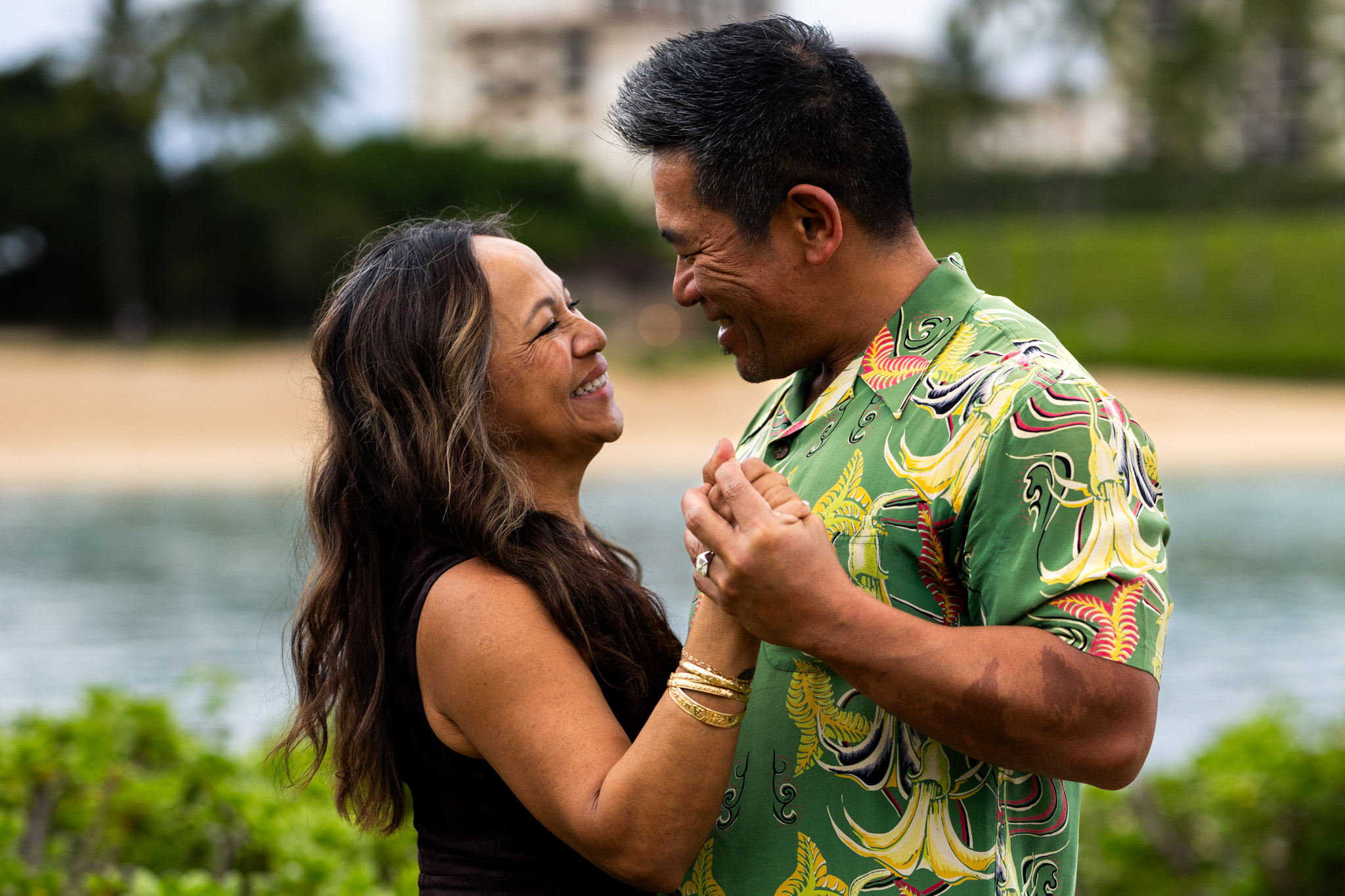 Couple laughing forehead to forehead at Ko Olina, Oahu